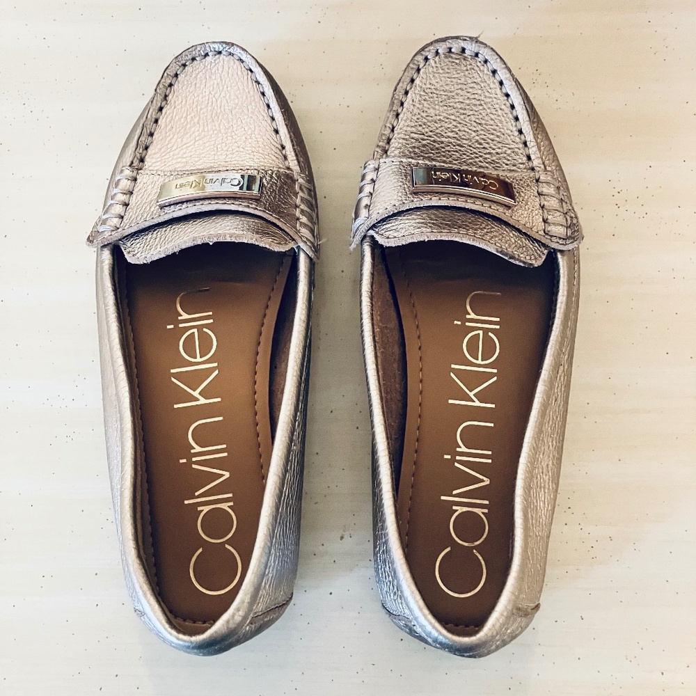 Calvin Klein gold loafers